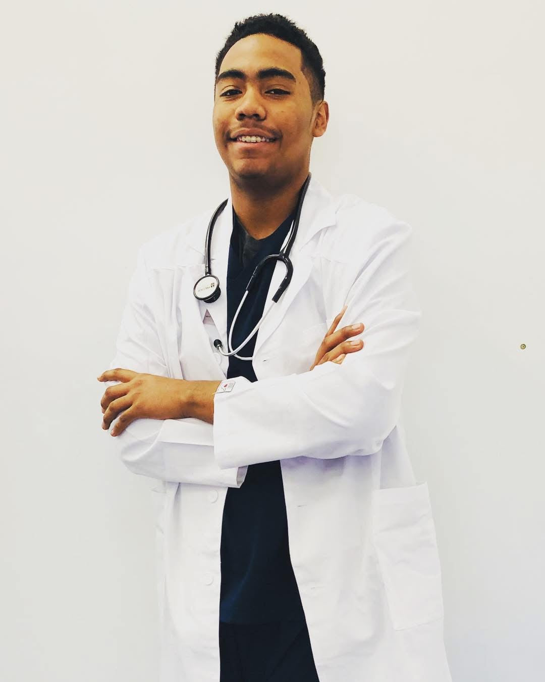 Doctor wearing white lab coat in medical setting"