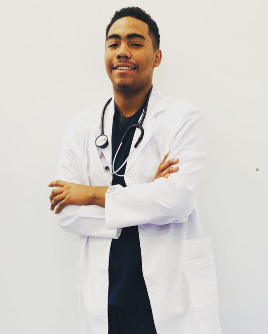 Doctor wearing white lab coat in medical setting"